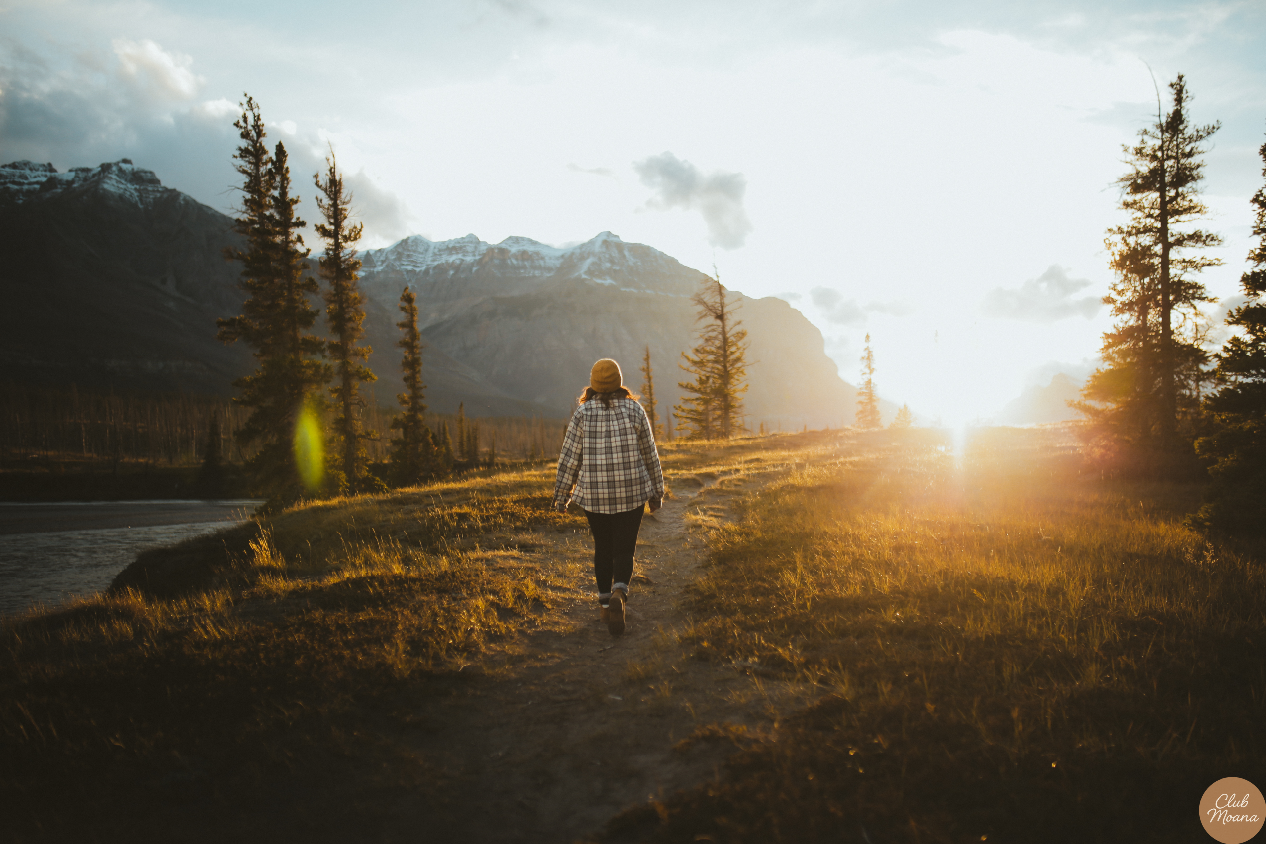 A man walking outdoors during sunrise, looking refreshed and energized